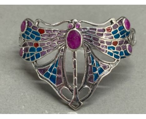 A silver and plique a jour cuff bangle in the Art Deco style with ruby panels 24.6g gross