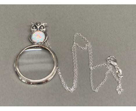 A silver magnifying glass pendant on silver chain with owl finial and opal cabochon 14.6g gross