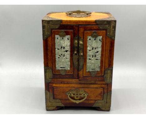 A orienta box with jade and brass hints all over, made in shanghai china