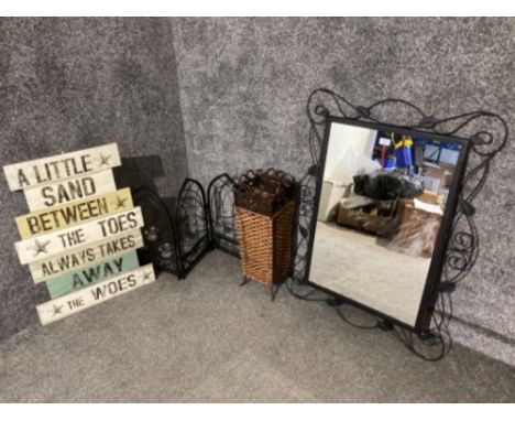 A metal framed wall mirror, wicker stick/umbrella stand, tea light holder and wall plaque