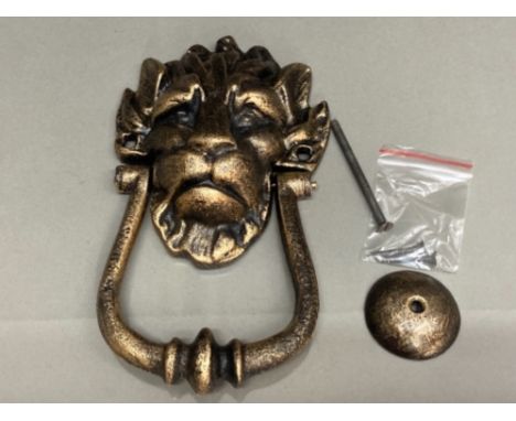 A reproduction cast metal 10 Downing Street knocker in the form of a lion