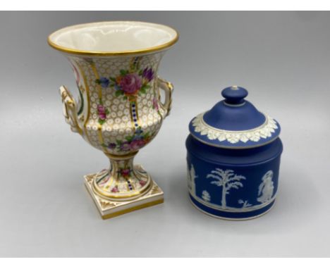 A 19th century Wedgwood blue jasperware sugar bowl and cover 11.5cm high And a A 20th century Dresden porcelain campana shape