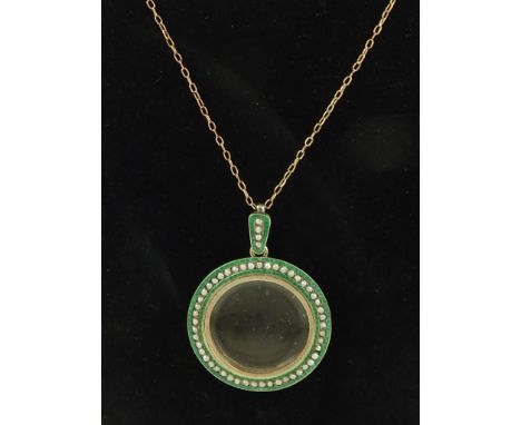 Magnifying lens pendant, green enamel with pearl decoration, 3.5cm dia