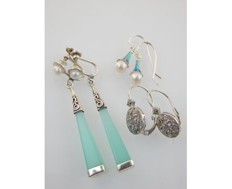 Pair of silver and diamond illusion earrings, pearl in enamel trumpet earrings, and pearl and silver obelisk earrings (3)