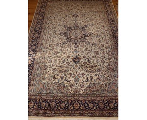 Keshan ivory ground rug, tear drop medallion to centre on foliate ground, 278 x 184cm