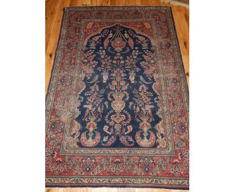 Persian Isfahan rug, the centre with floral shaped and blue ground medallion, within floral border, 200 x 134cm
