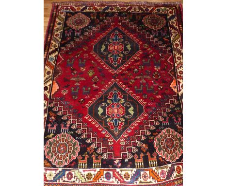 Caucasian red ground rug, two pole medallion to centre on zoomorphic ground, stepped bordes, fringed, 165 x 120cm