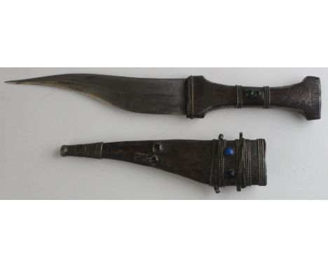 Dagger: A small silver Arab 'Jambiya' dagger. Blade 14cms. Shaped silver grip with bead decoration. In its silver mounted sca