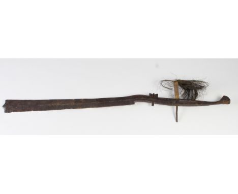 Sword: An interesting Eastern sword made from one piece of steel. Kora style blade 20". Stepped hilt with flattened pommel. S