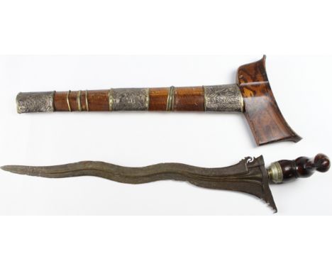 Dagger: A Japanese dagger 'KRIS' wavy iron blade (pitted) 15". Polished wood grip and crossguard (loose) silver (coloured) de