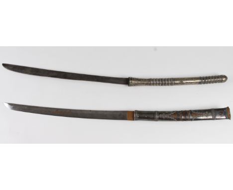 Swords: silver mounted Burmese swords 'DHA' Plain unfullered blades of 17" & 18" respectively. (Note the 17" blade appears to
