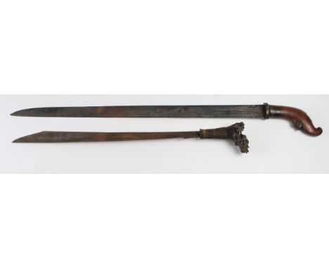 Swords: Far Eastern swords possibly Malayan, Indonesian Chinese? 1) A broadsword possibly Chinese. Blade 29.5". Smooth polish