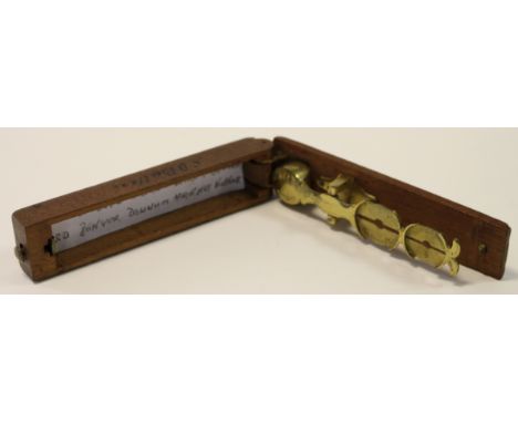 A set of Harrison Sovereign Scales c.19thC high grade in a wooden case (catch loose), with a modern paper note inside indicat