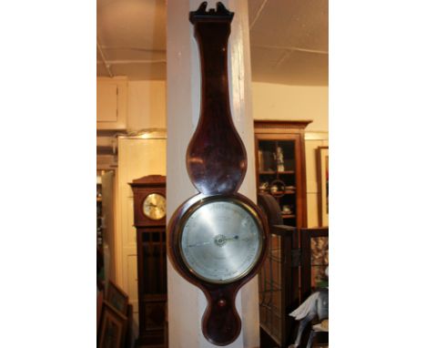 A 19th century mahogany cased wheel barometer marked Lione Somaluico & Co 125 Holb Hill, London