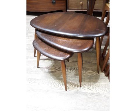 A set of three Ercol elm and beech nest of tables, blue label number 354 circa 1957.  