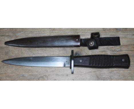 A WWII German trench knife, single edge steel blade stamped 'GOTTLIEB HAMMESFAHR SOLINGEN. FOCHE', the reverse with Imperial 