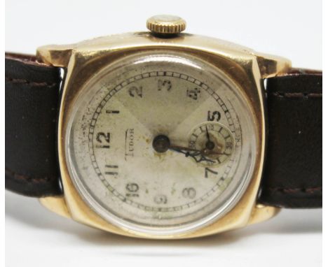 A 1930s unisex 9ct gold Tudor manual wind wristwatch, case diam. 27mm, fitted with later brown leather strap.  