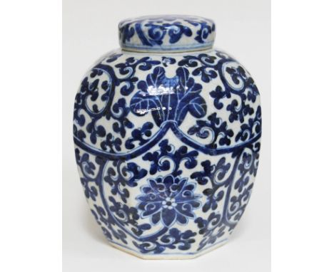 A Chinese porcelain ginger jar and cover of octagonal form and decorated in blue white with lotus flowers, double ring mark t