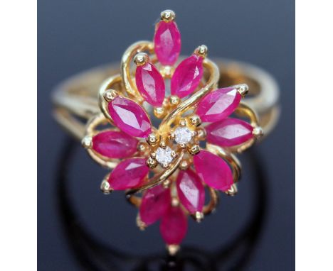 An 18ct gold diamond and ruby cluster ring, marked '18K' and '750', gross wt. 5.4g, size R.  