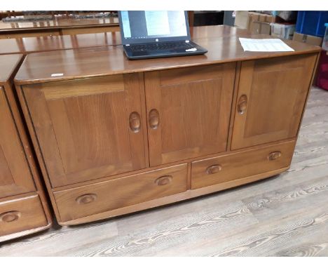 An Ercol blonde elm sideboard.  