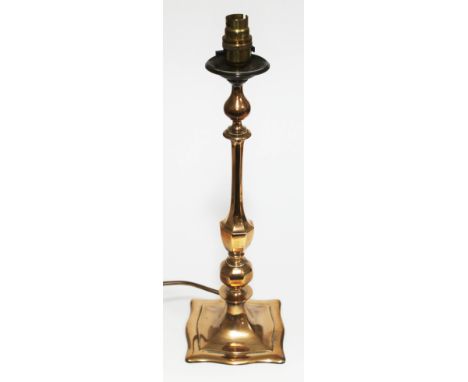 A brass table lamp with weighted base, height 43cm.  