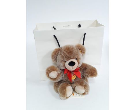 A Steiff Bobby bear 30cm, no. 013881, with button to ear, tags, Steiff box and paper bag. 