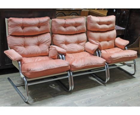 A set of three tubular chrome lounge chairs, width 67cm, depth 82cm &amp; height 90cm.  (This item may not comply with the Fu