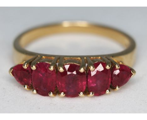 A hallmarked 14ct gold five stone ruby ring,  gross wt. 4.3g, size S.  