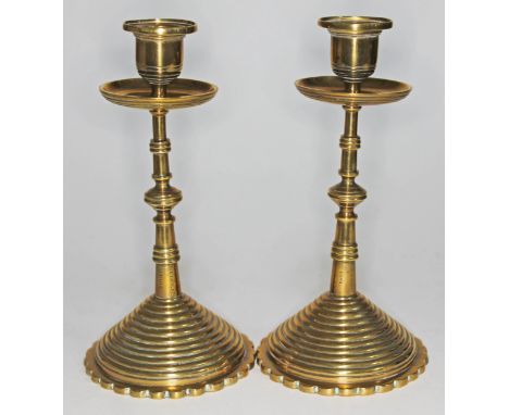 A pair of Arts & Crafts style brass candlesticks, inscribed 'I. Wragg St. Luke's 1881', height 21cm.Condition: small nigges/d