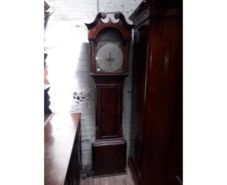 A Georgian mahogany long case clock circa 1800 with broken swan neck pediment, arched hood with fluted pillars and Corinthian