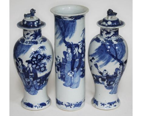 A group of three 19th century Chinese blue and white porcelain vases, each bearing a four character Kangxi mark, tallest 31.5