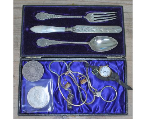 A mixed lot comprising a hallmarked silver Christening set (fork damaged), a Victoria crown, a George VI 1937 crown, a pair o