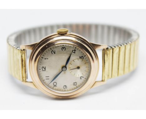A 1940s 9ct gold unisex manual wind wristwatch, case diam. 28mm, on flexi strap.  