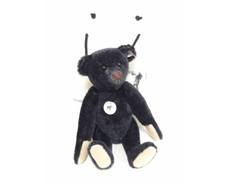 A Steiff Ltd edition black growling bear 1908 replica, no. 01422/3000, 35cm, no. 408564, black mohair, fully jointed, with bu