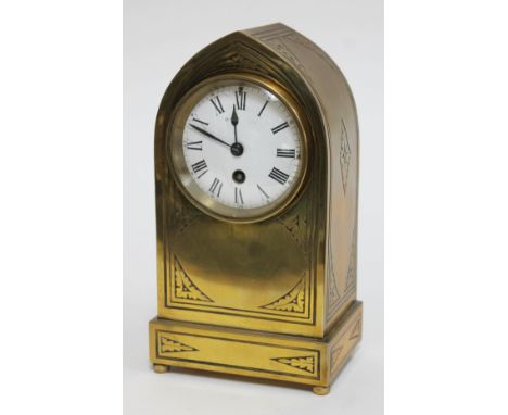 A late 19th century arched brass mantle clock, the movement stamped 'Maple &amp; Co Paris', height 27cm.  