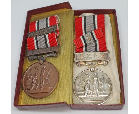 Two Fire Service medals, one hallmarked silver for twenty years service and another bronze, both award to A. Jones.  