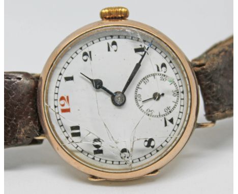 A 9ct gold trench style manual wind wristwatch with white dial, Arabic numerals and hands in black and seconds subsidiary dia