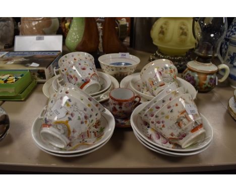 A selection of tea cups and saucers by Hilditch in a Chinoiserie design having London style handles