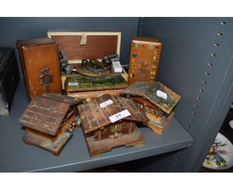 A collection of vintage trinket and jewellery boxes,some musical,others in the form of cottages also included is an assortmen