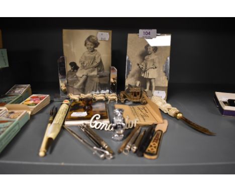 A miscellany of vintage and antique collectable including conductor badge,art deco photo frames, retractable pencils and more