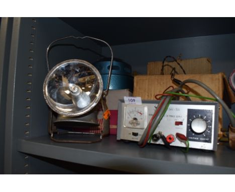 A vintage Desmo universal heater, a DC power supply and torch/lantern.