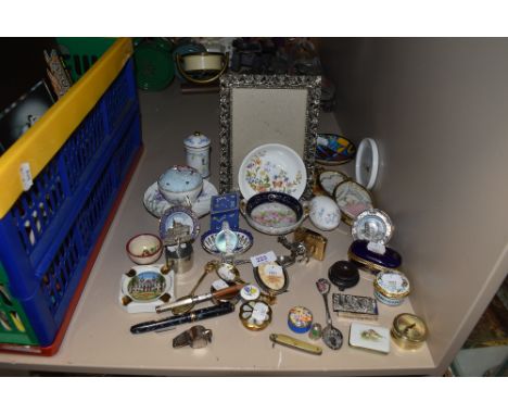 A selection of curios and trinkets including spoons pill boxes and Ibelo m23 cigarette lighter