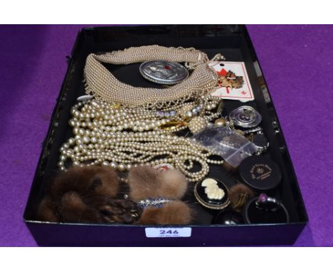 A tray of costume jewellery including strings of pearls, pearl collar, fur brooches  etc