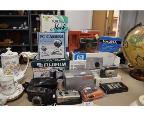 A selection of photographic equipment and similar cameras including boxed Canon Snappy EZ Ferrania and Kodak Instamatic