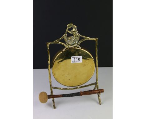 Early 20th century Brass Gong held on a stand of naturalistic form with a wooden handle striker, 31cm high 