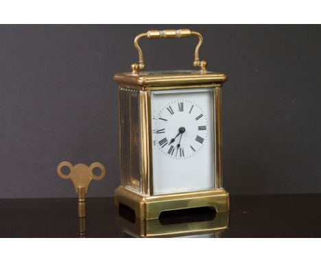 A French brass cased carriage clock, maker marked R&amp;G, white enamel dial and complete with key. 