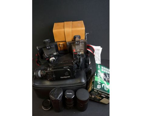 A large quantity of photography equipment to include cameras, lenses, tripod and gadget bags. 