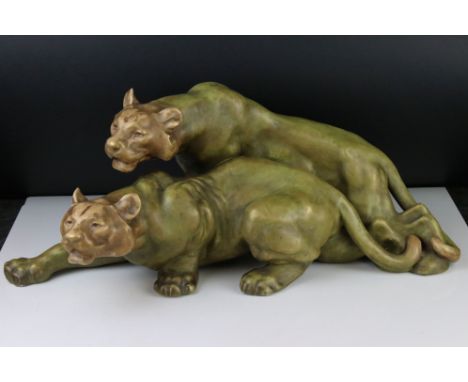 In the manner of Royal Dux , pair of 1930's Ceramic Lionesses, 54cm long 