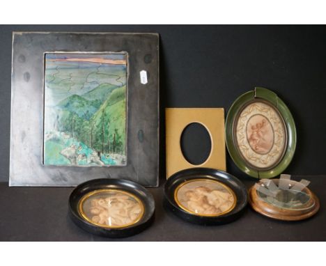 A small collection of 19th century framed miniatures together with an enamel picture within a metal frame. 