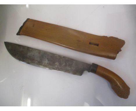 An early 20th century South East Asian knife in a scabbard